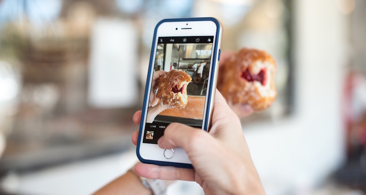 taking a picture with a smartphone camera of a donut