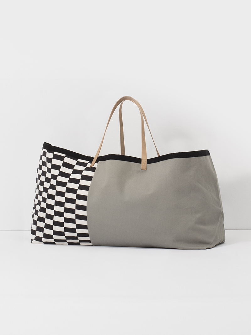 full-looking gray handbag perfectly stuffed for handbag product photography