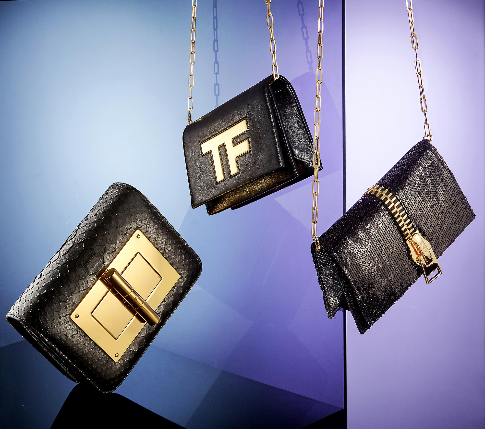hangings bags like these three black purses is a clever way to showcase handbag product photography