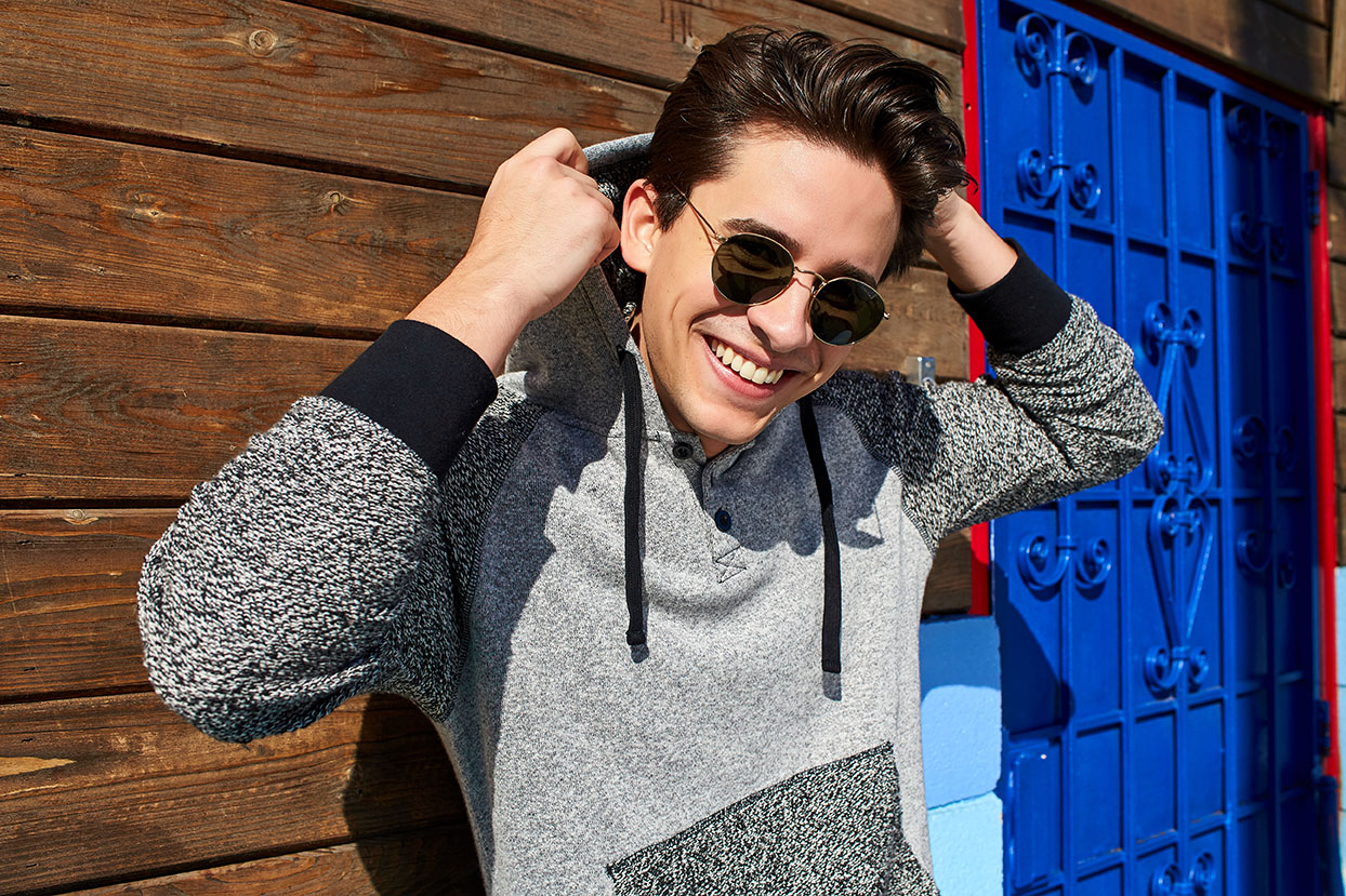 Man in sunglasses and gray hoodie from PX Clothing