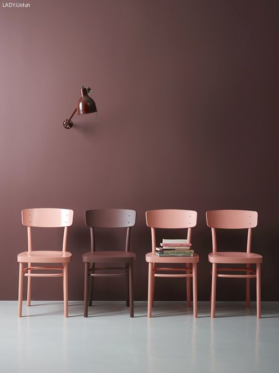 4 matching or complementary pink and brown chairs photographed together to show context