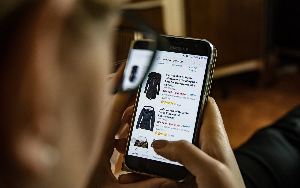 User purchasing jackets through mobile commerce on their phone