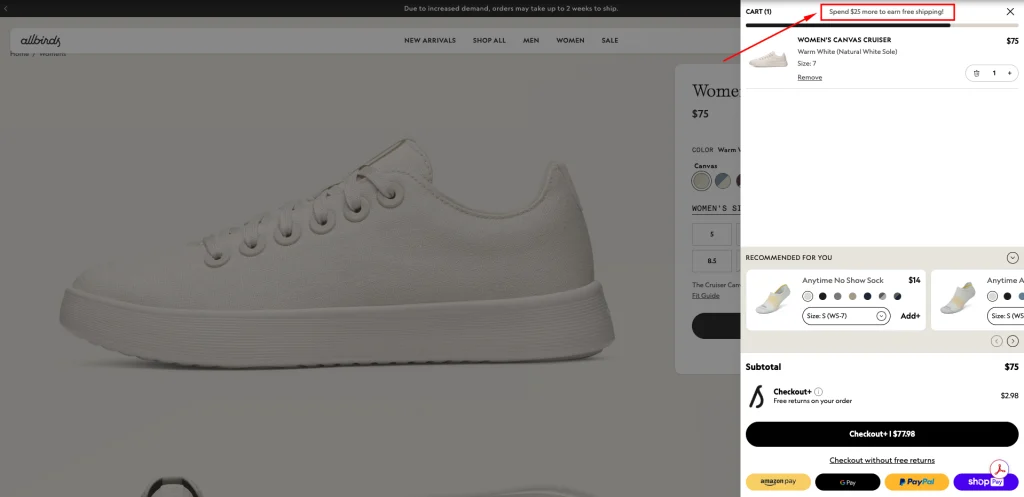Allbirds cart drawer highlighting a 'Spend $25 more to earn free shipping!' nudge with a progress bar and recommended products.